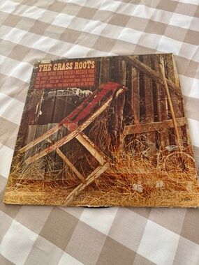 The Grass Roots Vintage Album Cover Featuring Red Chair Art